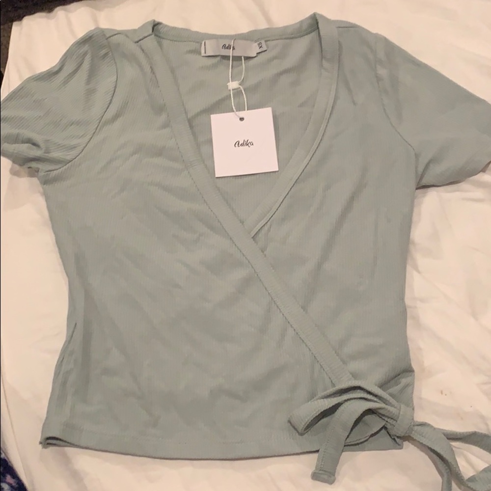 adika rap top size xs brand new with tag